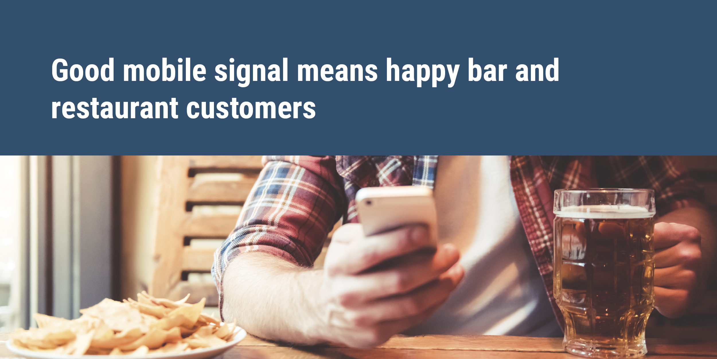 Good mobile signal means happy bar and restaurant customers - man on mobile phone eating and drinking in pub