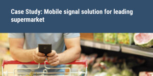 Case Study: Mobile signal solution for leading supermarket man on phone in supermarket