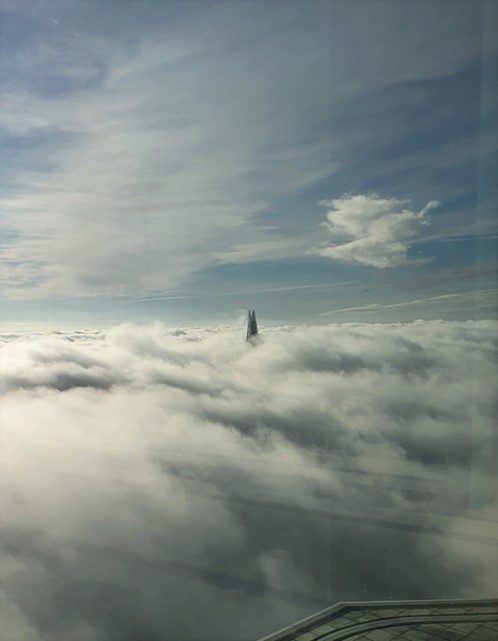 22 bishopsgate tip peeping through the clouds - mobile signal in high rise